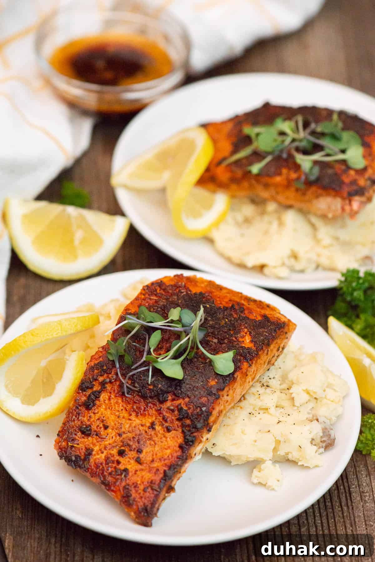Blackened Salmon Recipe: Spicy Cajun Pan-Seared Fillets 2 blackened salmon over mashed potatoes.
