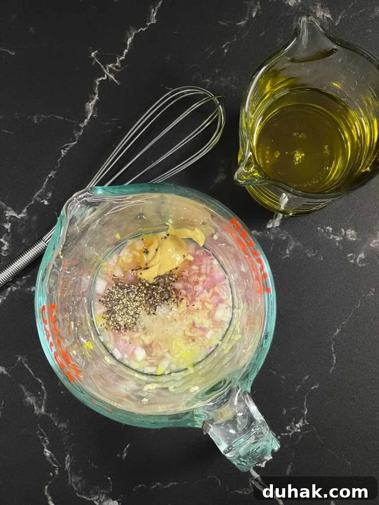 Preparing vinaigrette for no mayo potato salad.
