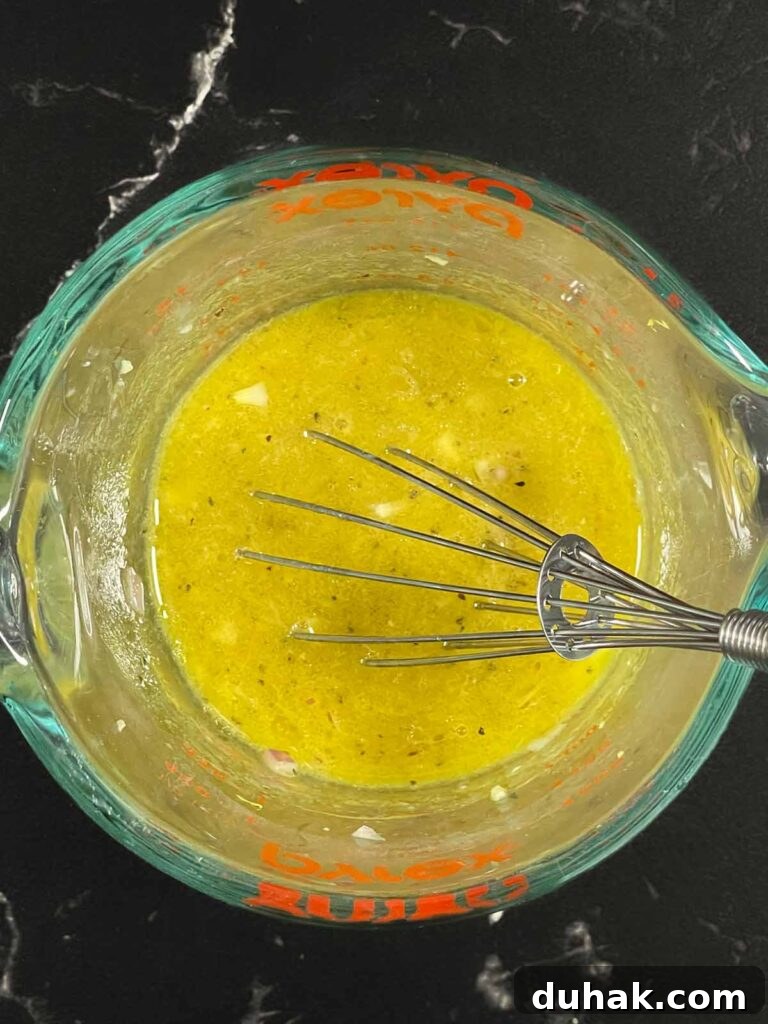 Whisking lemon dill vinaigrette for green bean potato salad.