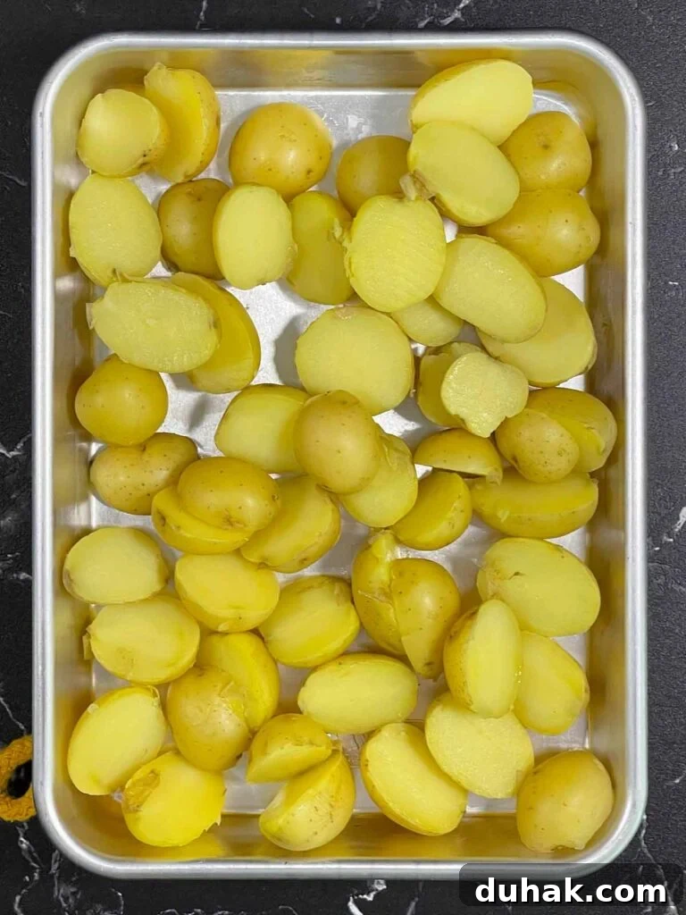 Baby Yukon Gold potatoes sliced in half.