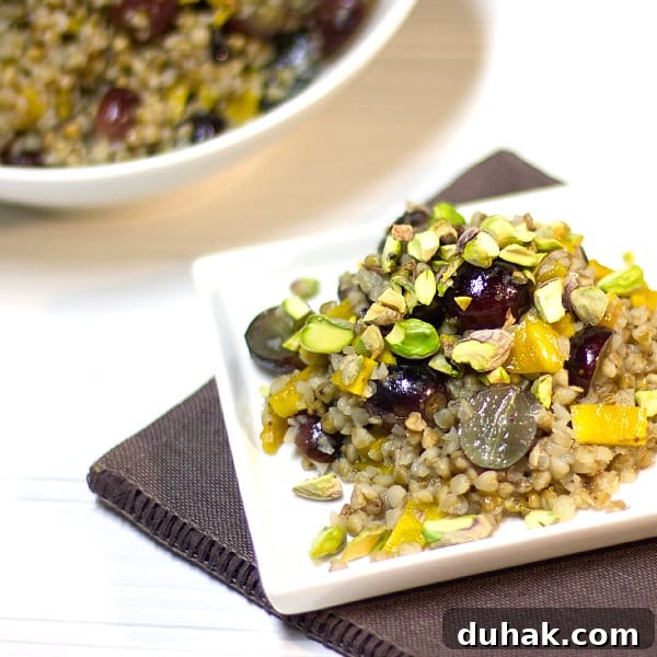 A gluten free salad made with kasha (roasted buckwheat), grapes, dried mango, pistachios and a honey lime dressing.