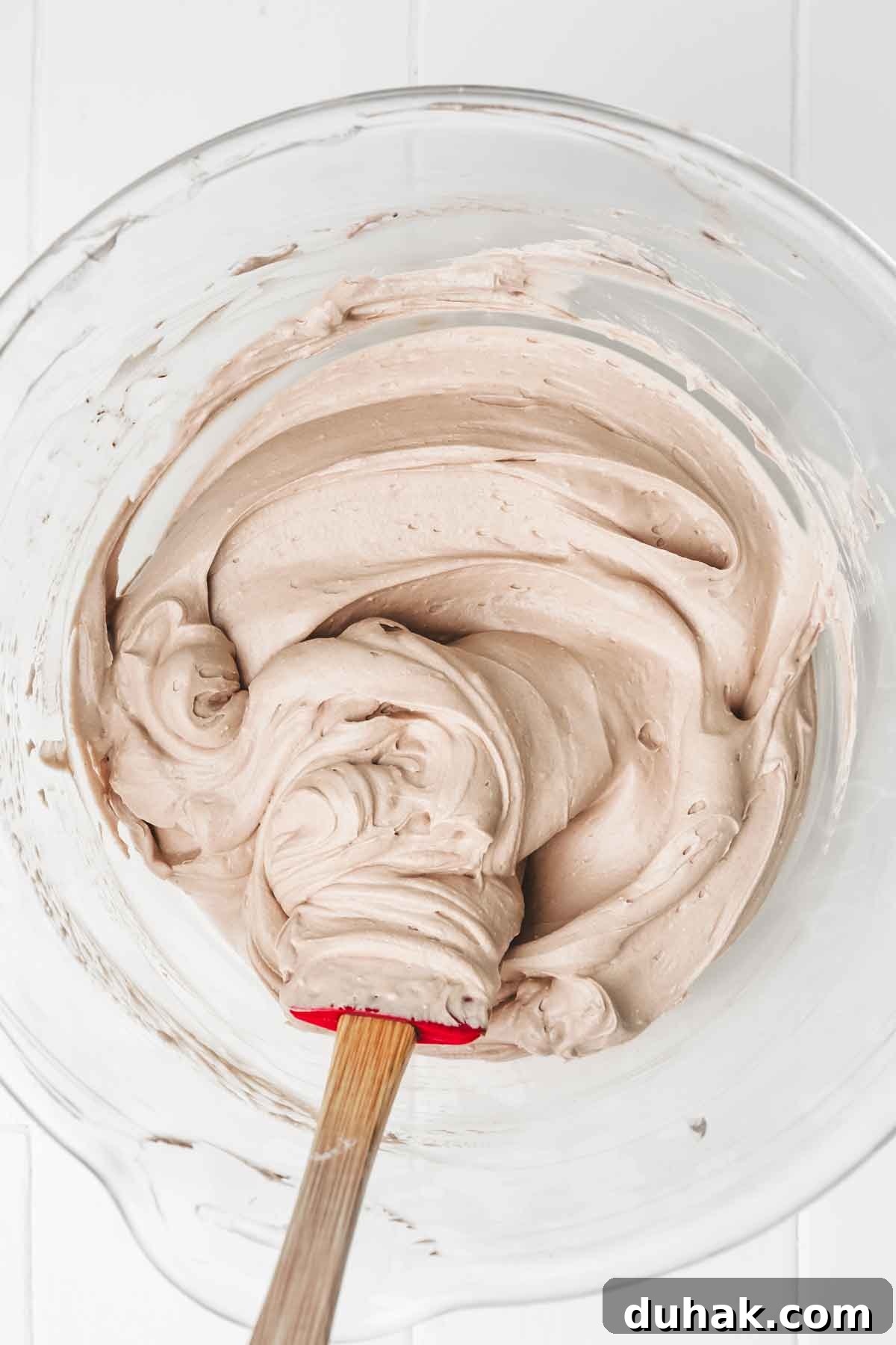 Decadent Nutella Chocolate Cake Recipe for Chocolate Lovers 7 Nutella mascarpone frosting being whipped in a bowl