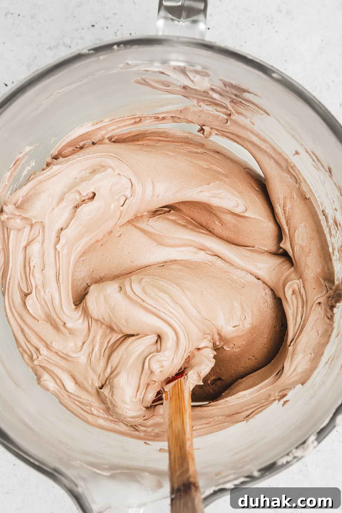 Decadent Nutella Chocolate Cake Recipe for Chocolate Lovers 8 Nutella Swiss meringue buttercream in a mixing bowl