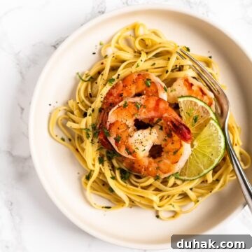 a top down view of a plate of cilantro lime shrimp pasta