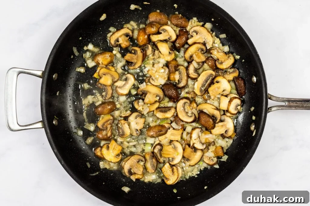 Cooking wine off the mushrooms.