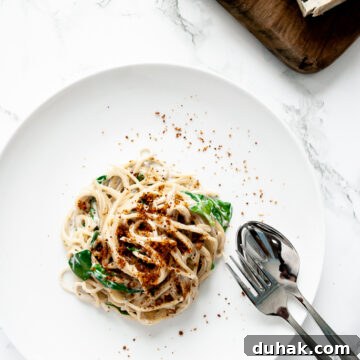a plate of spaghetti with gorgonzola sauce