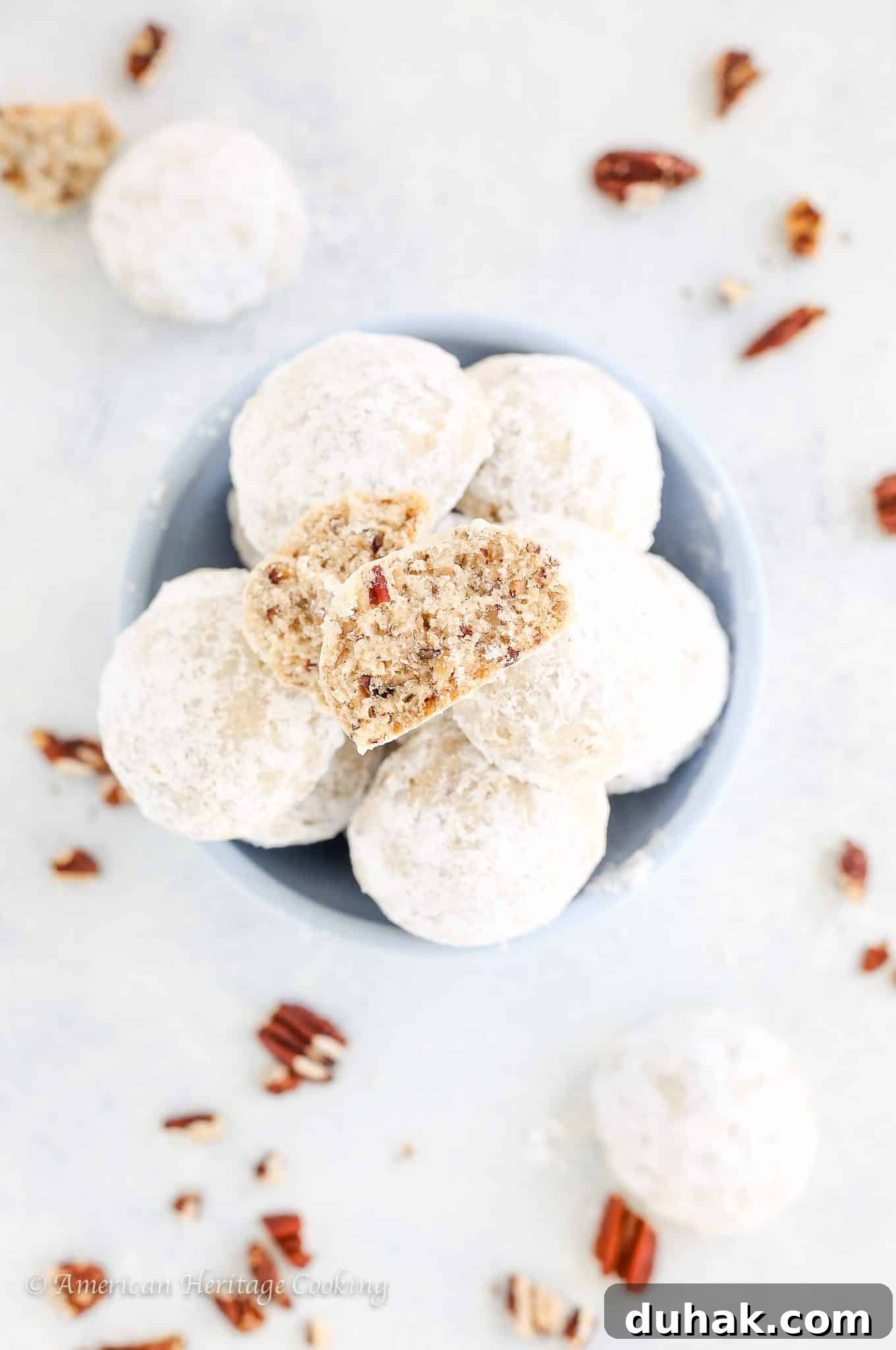 Mexican Wedding Cookies Recipe — Classic Crescent Cookies Guide 3 Mexican wedding cookies on white countertop with pecans.