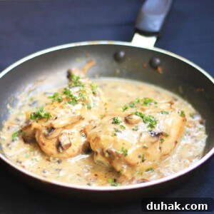 Creamy Mushroom Chicken Skillet with Garlic and Herbs 3 Chicken in Mushroom Sauce served in a black pan