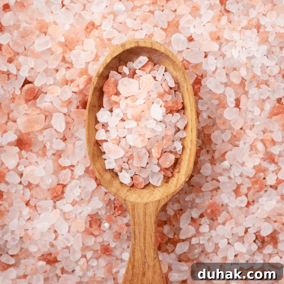 pink salt on a spoon