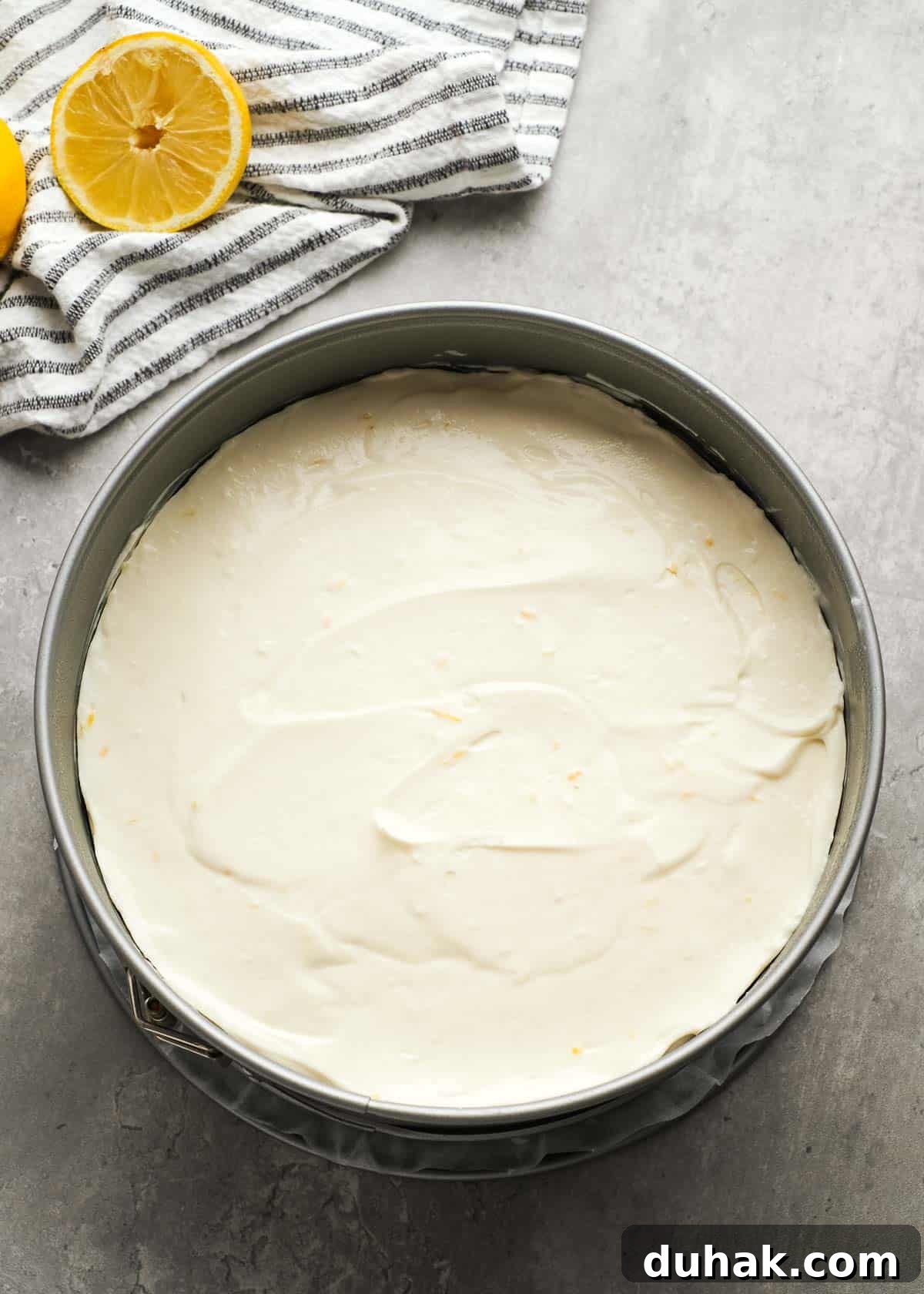 Lemon Cheesecake Recipe with Zesty Citrus Cream Filling 10 lemon cheesecake mixture smoothed over a graham cracker crust in a springform pan