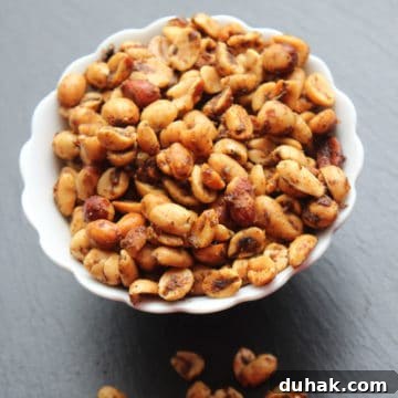 Spicy Crock-Pot Chili with Nuts: Slow Cooker Recipe 5 Spicy peanuts in a white bowl with a few below the bowl