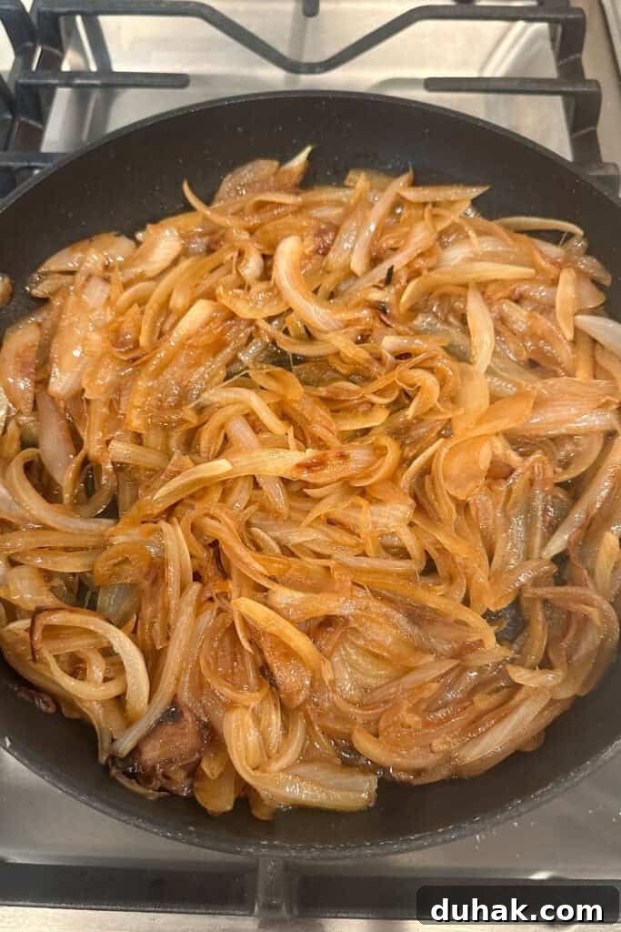 How to Make Sweet Caramelized Onions for Any Dish 4 A large cast iron pan with this caramelized onions recipe.
