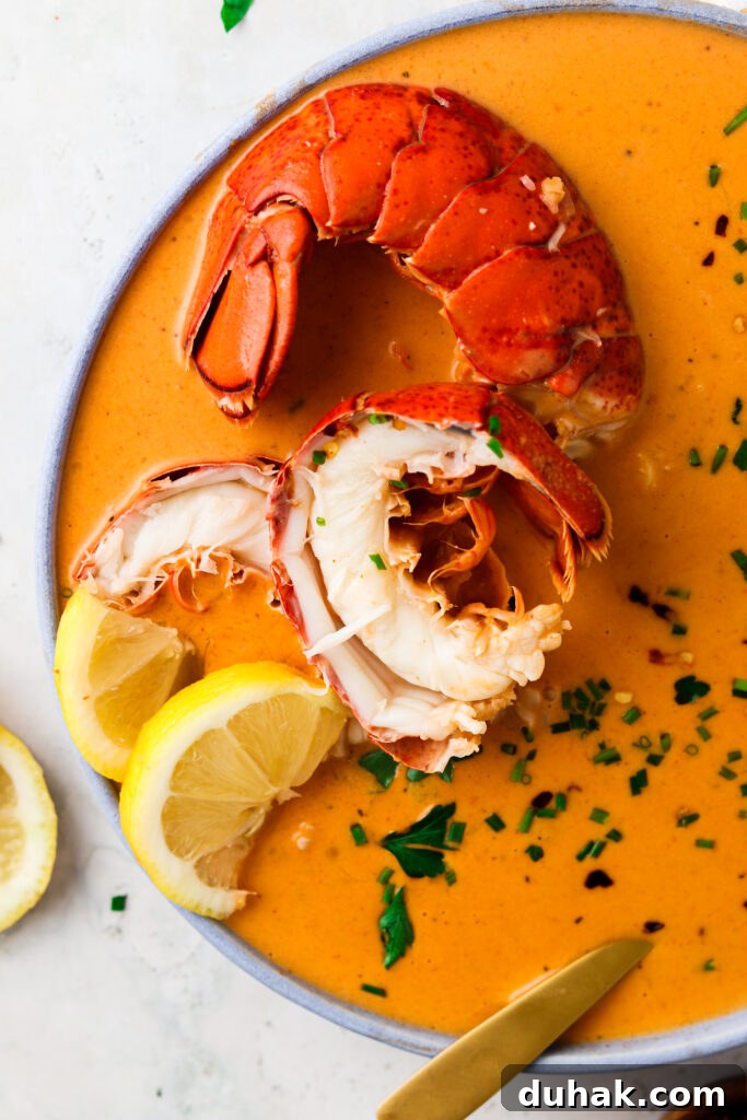 the best lobster bisque recipe in a blue bowl