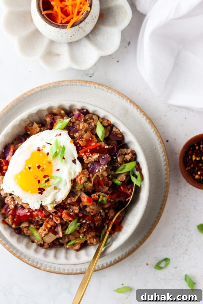 paleo egg roll in a bowl with an egg on top