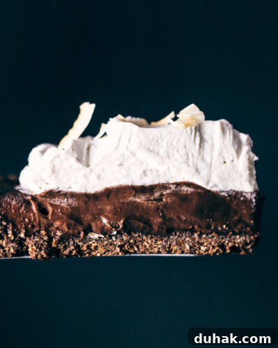 Slice of chocolate coconut cream pie being served