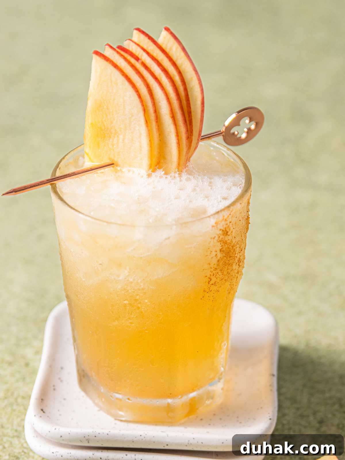 Ginger ale topped with bourbon in a glass.