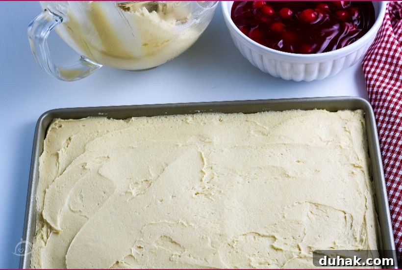 Glazed Cherry Bars: Simple Sweet Dessert Bars Recipe 4 Crust in a baking pan with bowl of cherry pie filling in background | A Reinvented Mom