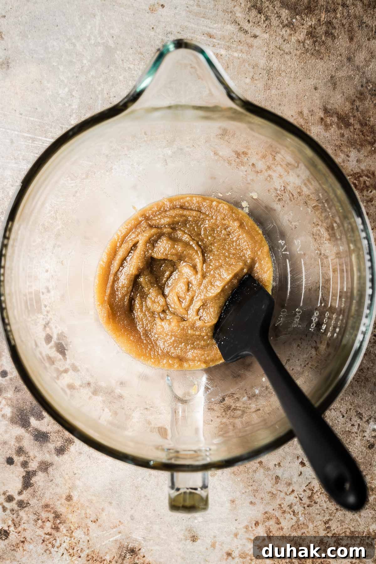 Double Cocoa Chocolate Cookies: Rich, Soft Baked Treats 7 Melted butter and sugar mixed together in a bowl.