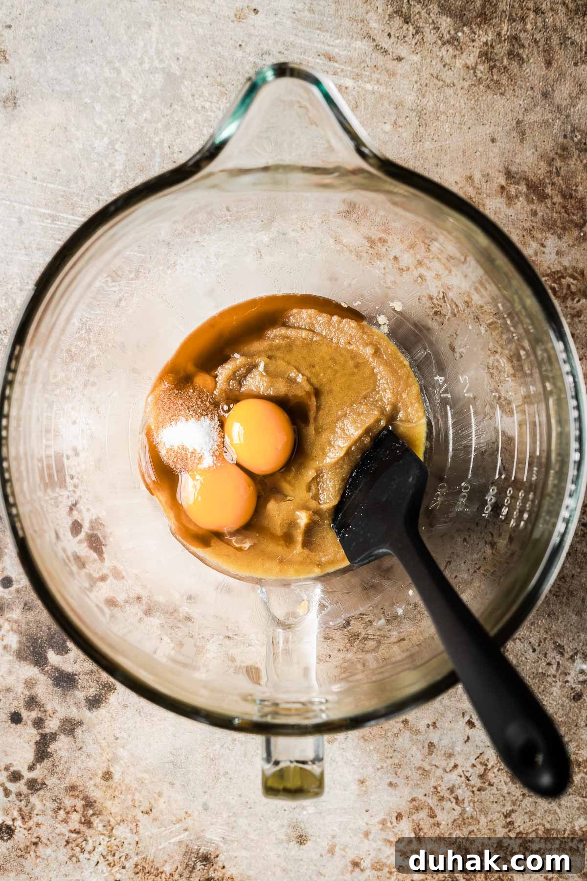 Double Cocoa Chocolate Cookies: Rich, Soft Baked Treats 8 Eggs, vanilla and salt being mixed into butter and sugar in a bowl.