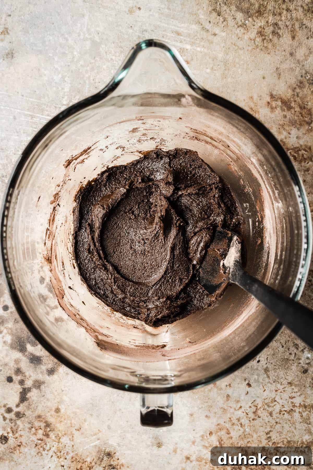 Double Cocoa Chocolate Cookies: Rich, Soft Baked Treats 10 A mixing bowl with dry and wet ingredients for cookies stirred together.