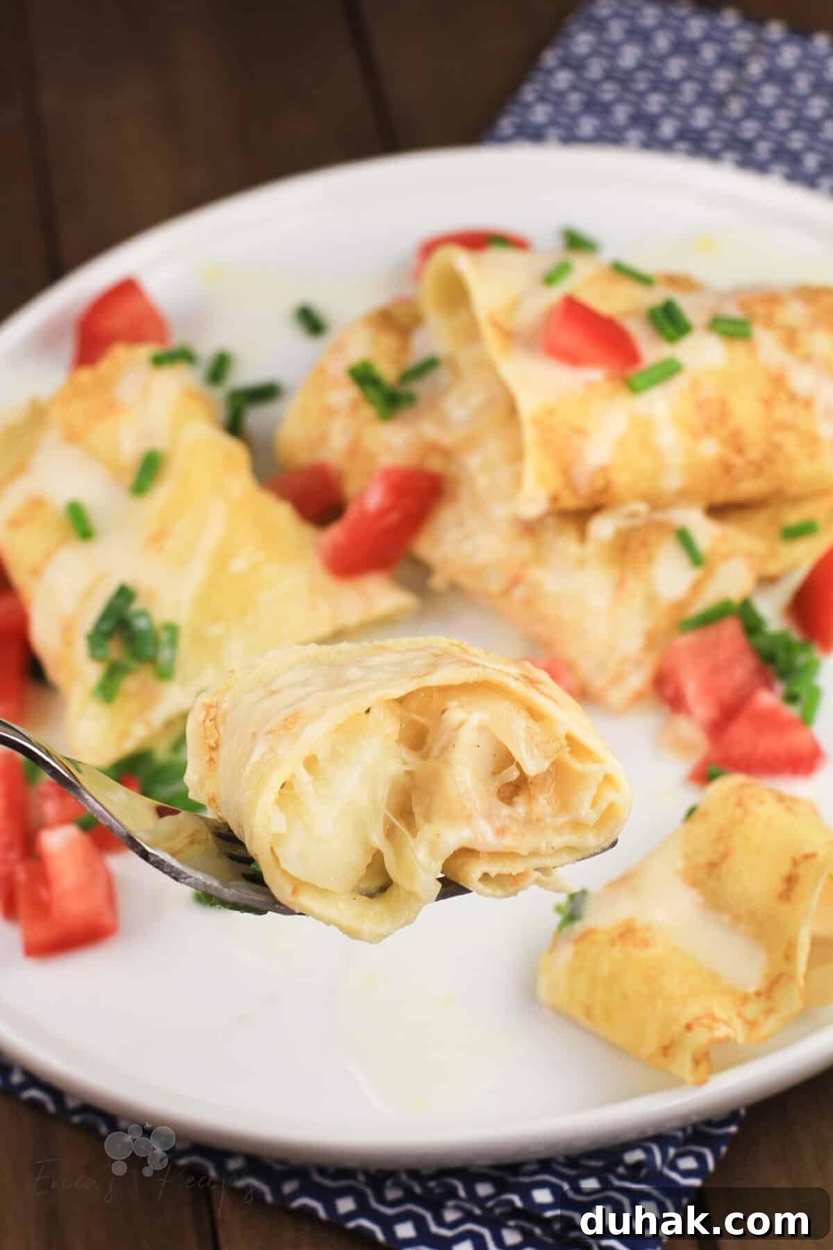 Savory Chicken and Potato Crepes: Rustic Filling Recipe 3 fork holding a bite of crepes with chicken and potato