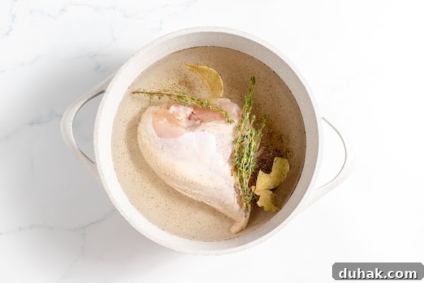 Comforting Gluten-Free Chicken with Fluffy Dumplings 5 chicken in a pot with herbs