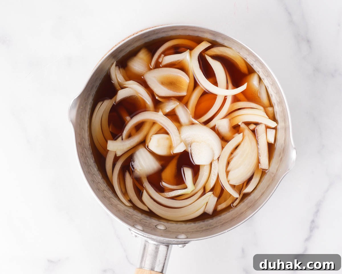 Authentic Gyudon: How to Make Japanese Beef Bowl at Home 4 Cooking onions for gyudon