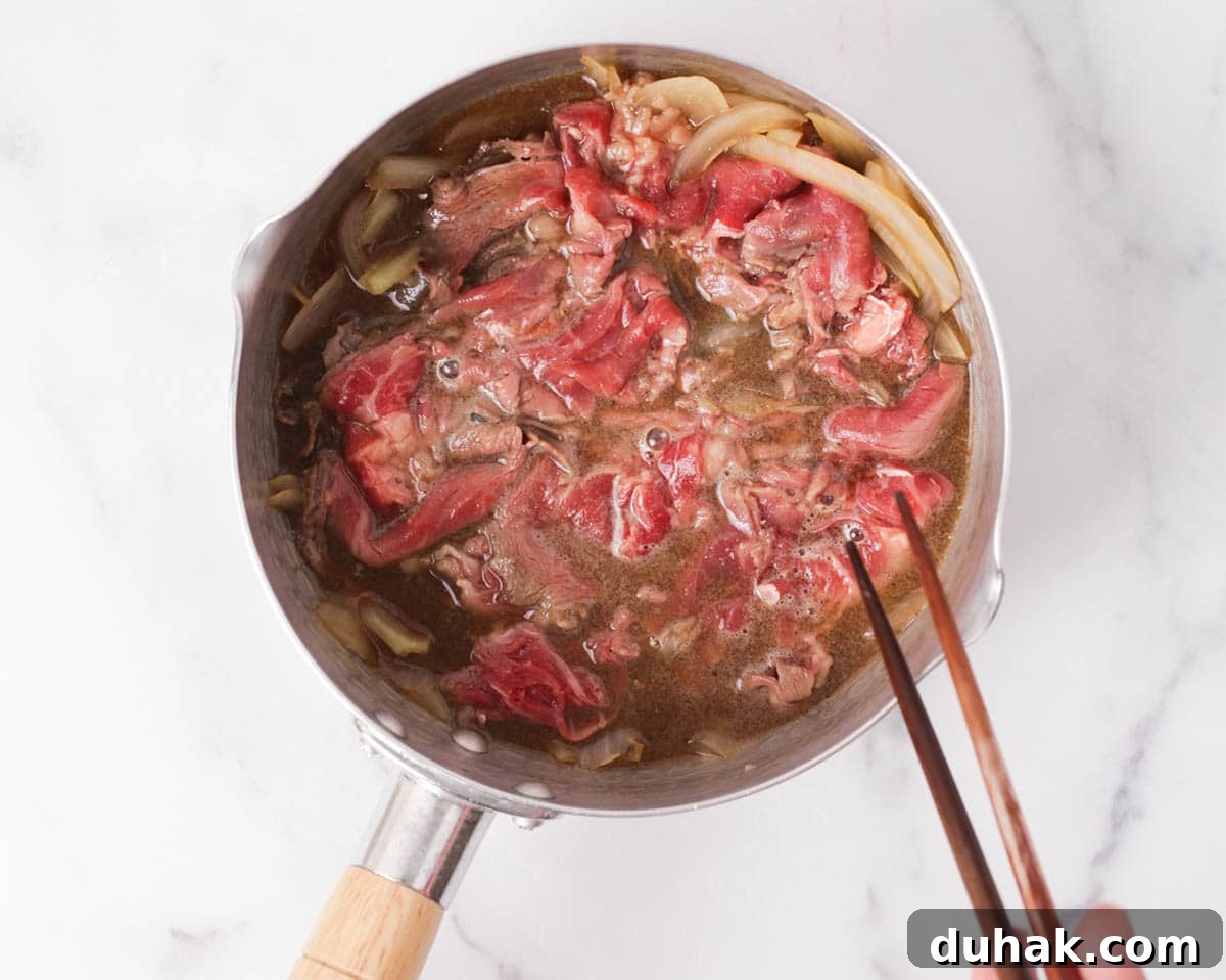 Authentic Gyudon: How to Make Japanese Beef Bowl at Home 5 Adding beef to the pan