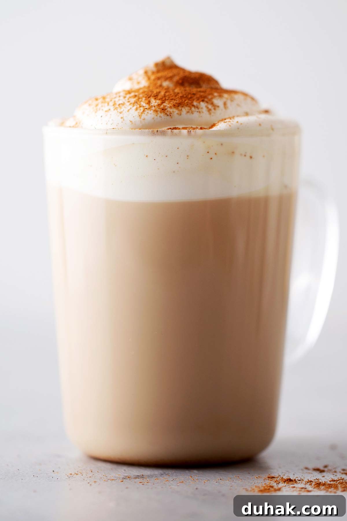 Pumpkin Spice Latte Recipe: How to Make a Cozy Fall Coffee 9 Pumpkin Spice Latte in a glass mug.