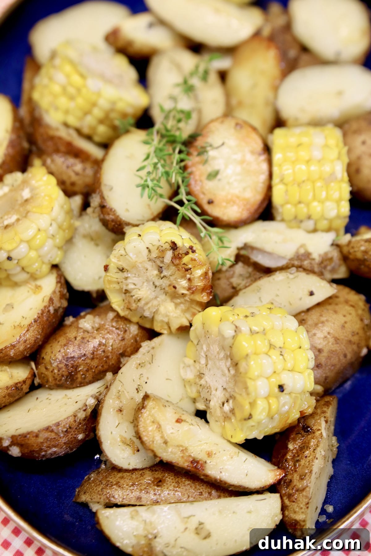 Grilled Potatoes with corn on the cob.