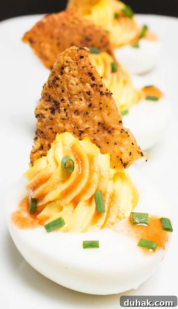 Close up of a Fried Chicken Skin Deviled Egg.