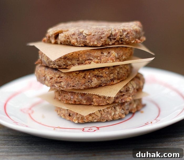 Round banana dog biscuits piled on top of each other with parchment in between served on plate 